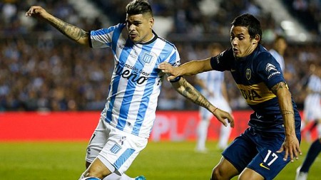 AVELLANEDA, ARGENTINA - OCTOBER 18:  Gustavo Bou of Racing Club fights for the ball with Marcelo Meli of Boca Juniors during a match between Racing Club and Boca Juniors as part of round 28 of Torneo de Primera Division at Presidente Peron Stadium on October 18, 2015 in Avellaneda, Argentina. (Photo by Gabriel Rossi/LatinContent/Getty Images)